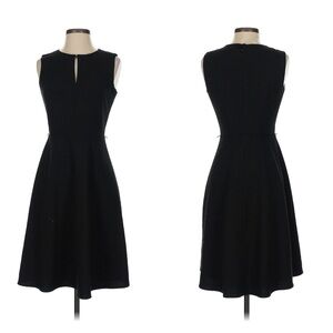 Calvin Klein midi length, black cocktail dress w keyhole opening and belt loops